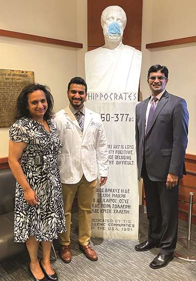 Drs. Kodali and Mathai with their son, Rajiv, at his ӰԺ White Coat Ceremony in 2021.